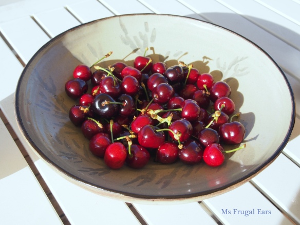 Cherries in pottery bowl